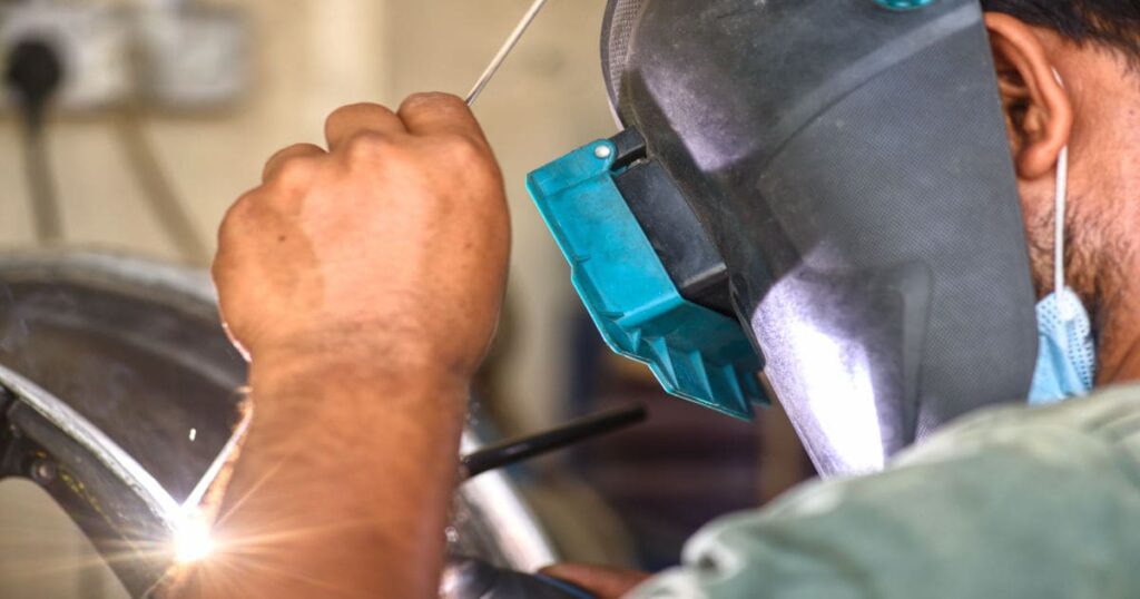 man doing metal works